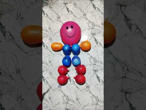 A beautiful smiling ☺️baby made from water balloons #colors #balloon #trend #rainbow #apnatv #water